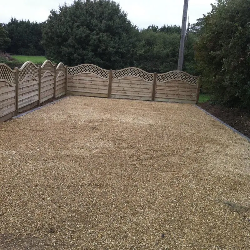 A driveway section for a couple of cars, fenced with continental panels