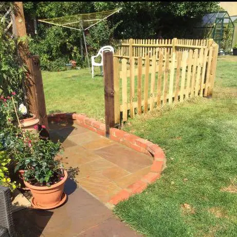 Picket fencing and a patio extension